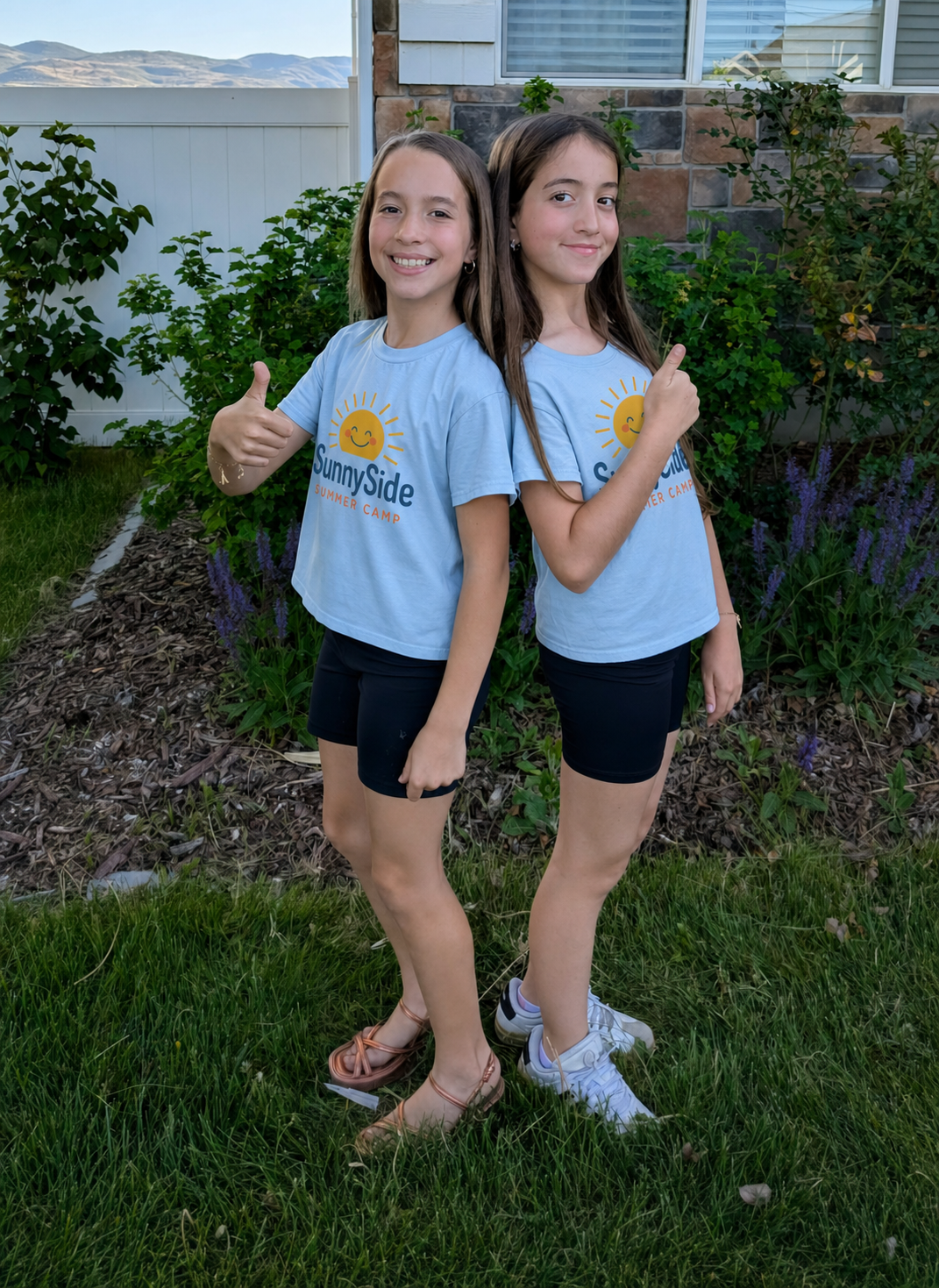 Natalie Christensen and Alexa White wearing SunnySide Summer Camp shirts
